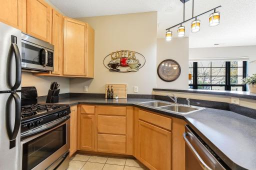 Modern stainless steel appliances bring a sleek, contemporary look to the kitchen
