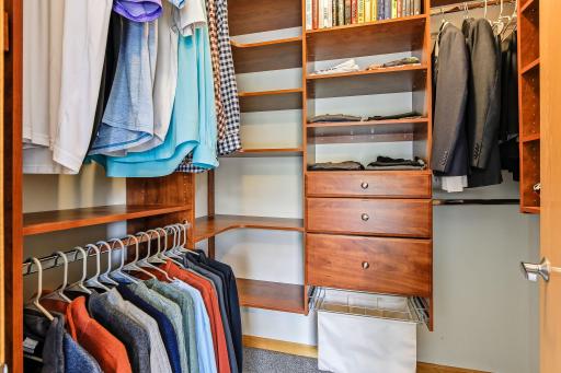 Primary custom closet designed for optimal organization, featuring tailored storage solutions that maximize space and keep everything neatly arranged and easily accessible.