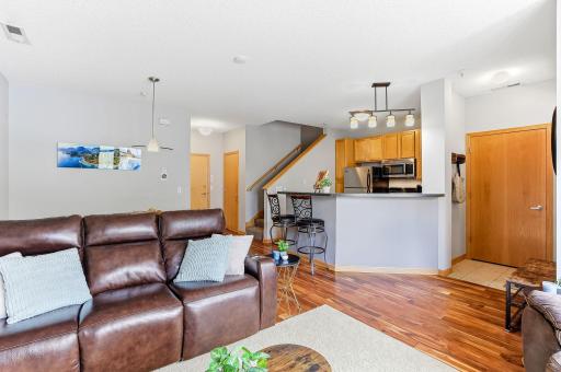Bar seating offers a casual and inviting spot for meals, morning coffee, or entertaining, seamlessly connecting the kitchen and living space for easy conversation and everyday convenience.