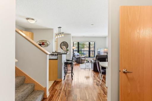 Gorgeous hardwood floors add warmth and character throughout the space, showcasing rich tones and a timeless finish that complements any style.
