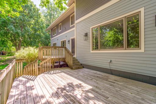 Large deck provides an ideal setting for grilling, dining, and enjoying views of the private backyard.