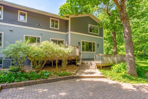 Beautiful paver patio creates the perfect space for outdoor entertaining, relaxing, or gathering around the fire pit.