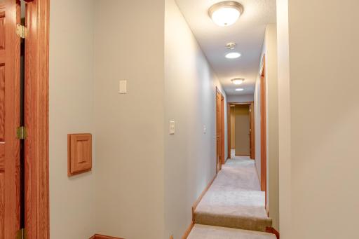 Light-filled upper-level hallway enhanced by solar tubes, bringing in natural daylight and creating a bright, welcoming connection between the home's private spaces.