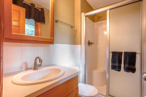Convenient upper-level Â¾ bath with a walk-in shower and clean, functional design for guests or family members.