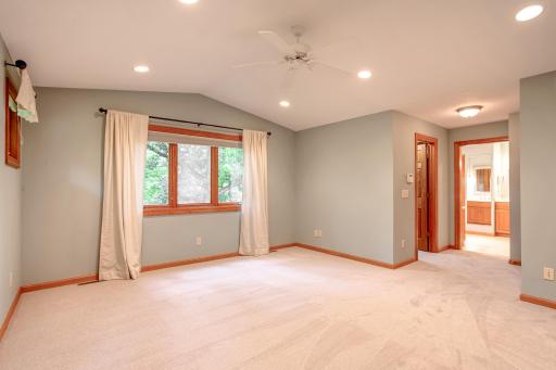 Oversized primary suite with ample space for a sitting area and direct access to the ensuite bath, blending comfort and functionality.