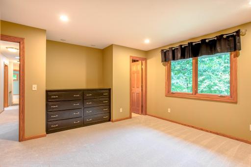Spacious guest bedroom with abundant natural light offering both comfort and an ensuite bathroom.
