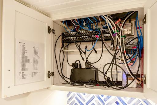 Dedicated structured wiring and network panel supports modern connectivity needs, providing an organized hub for technology and home systems.