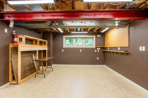 Well-equipped workshop provides generous room for tools, storage, and hands-on projects, offering endless possibilities for makers and hobbyists.