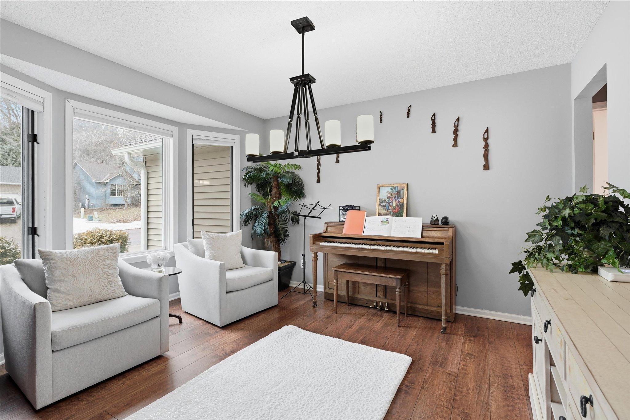 Versatile main floor space with a bay window—perfect as a formal dining room, music/sitting room, or home office.