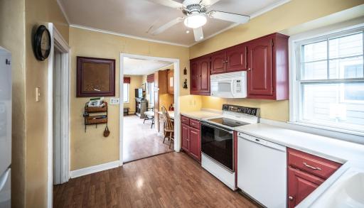 Kitchen with ceiling fan, kitchen window & newer LG refrigerator with ice maker