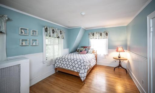 Second upper level bedroom with solid hardwood floors