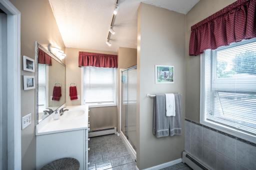 Primary full bathroom features a stand-alone shower & tub and tile flooring