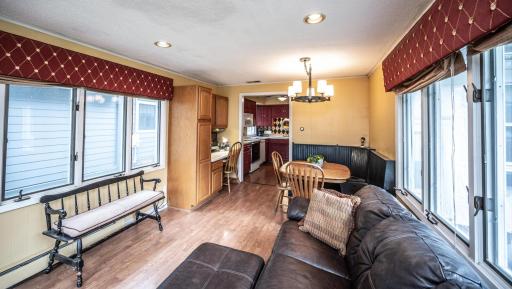 View from family room toward the kitchen. Includes small desk area & informal dining.