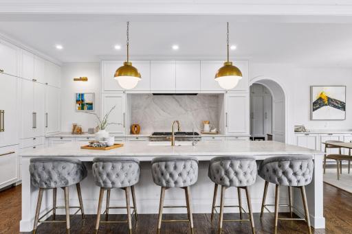 The main level centers on a Chef's Kitchen with no detail spared