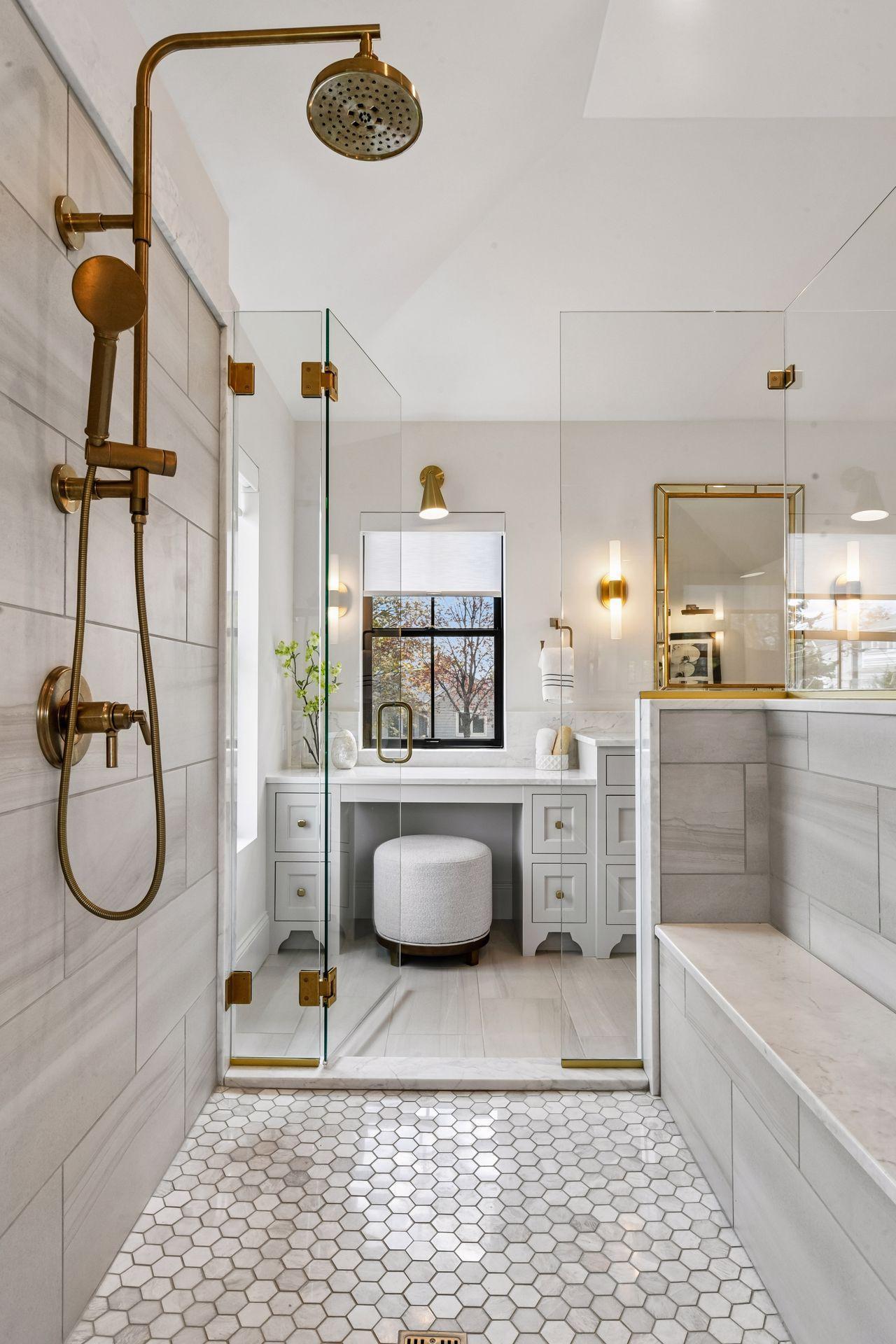 Primary bathroom retreat features in floor heat, free standing soaking tub and walk through tiled shower