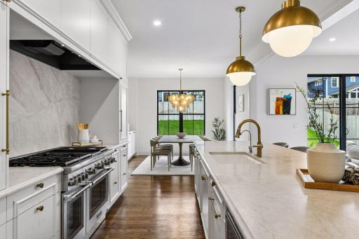 Chef's Kitchen includes Taj Mahal Quartzite, 48 inch Thermador range and paneled appliances