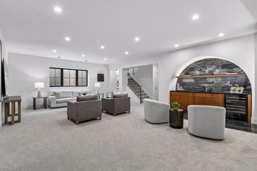 Lower level is built for entertainment. Featuring large family room space, custom built in bar and game nook.