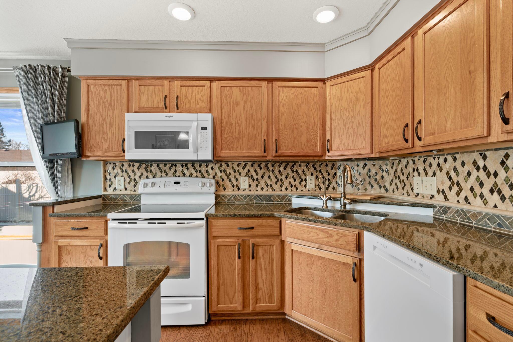 Generous cabinet space and stylish backsplash.