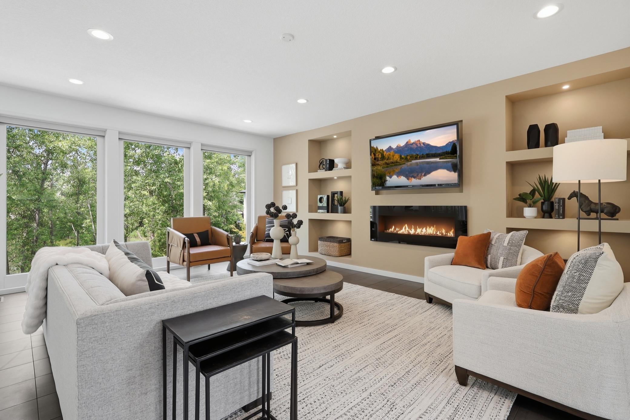 Warm modern elements greet you on the main level. One of two fireplaces are here in the main level living room.
