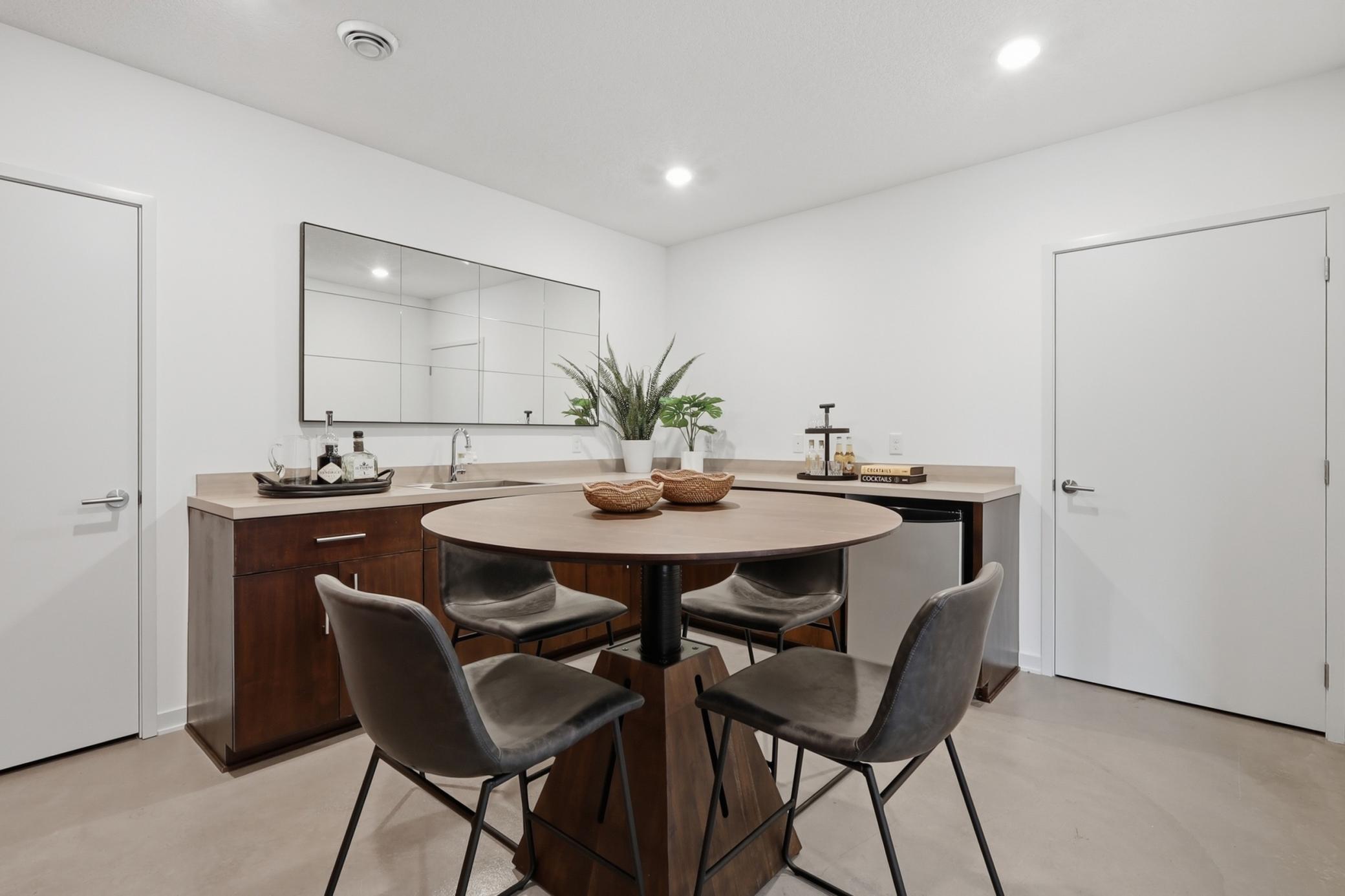 The lower level wet bar is the perfect flexible space with two storage closets!