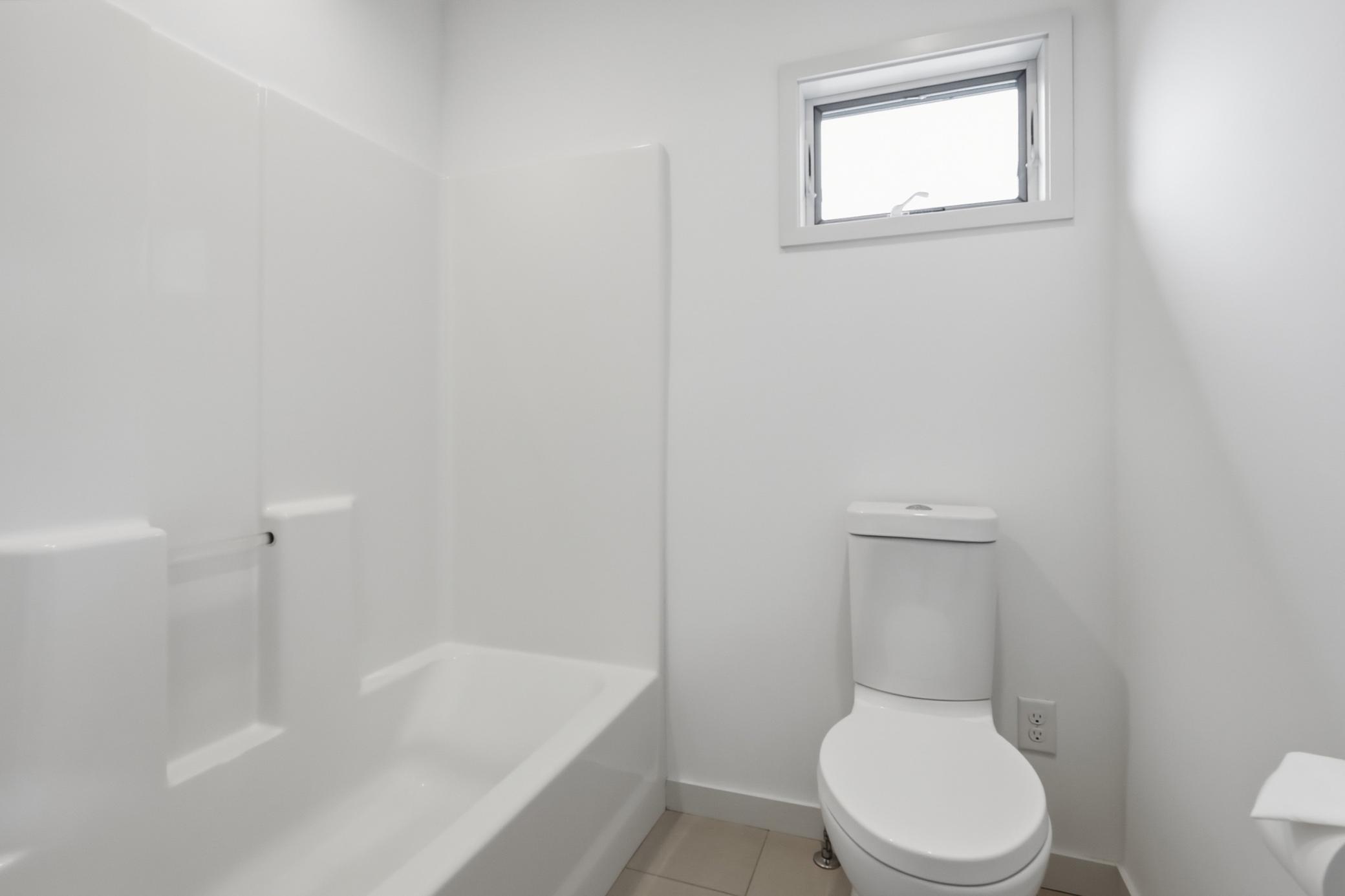 There’s a separated water closet and shower area in the shared bathroom for privacy.