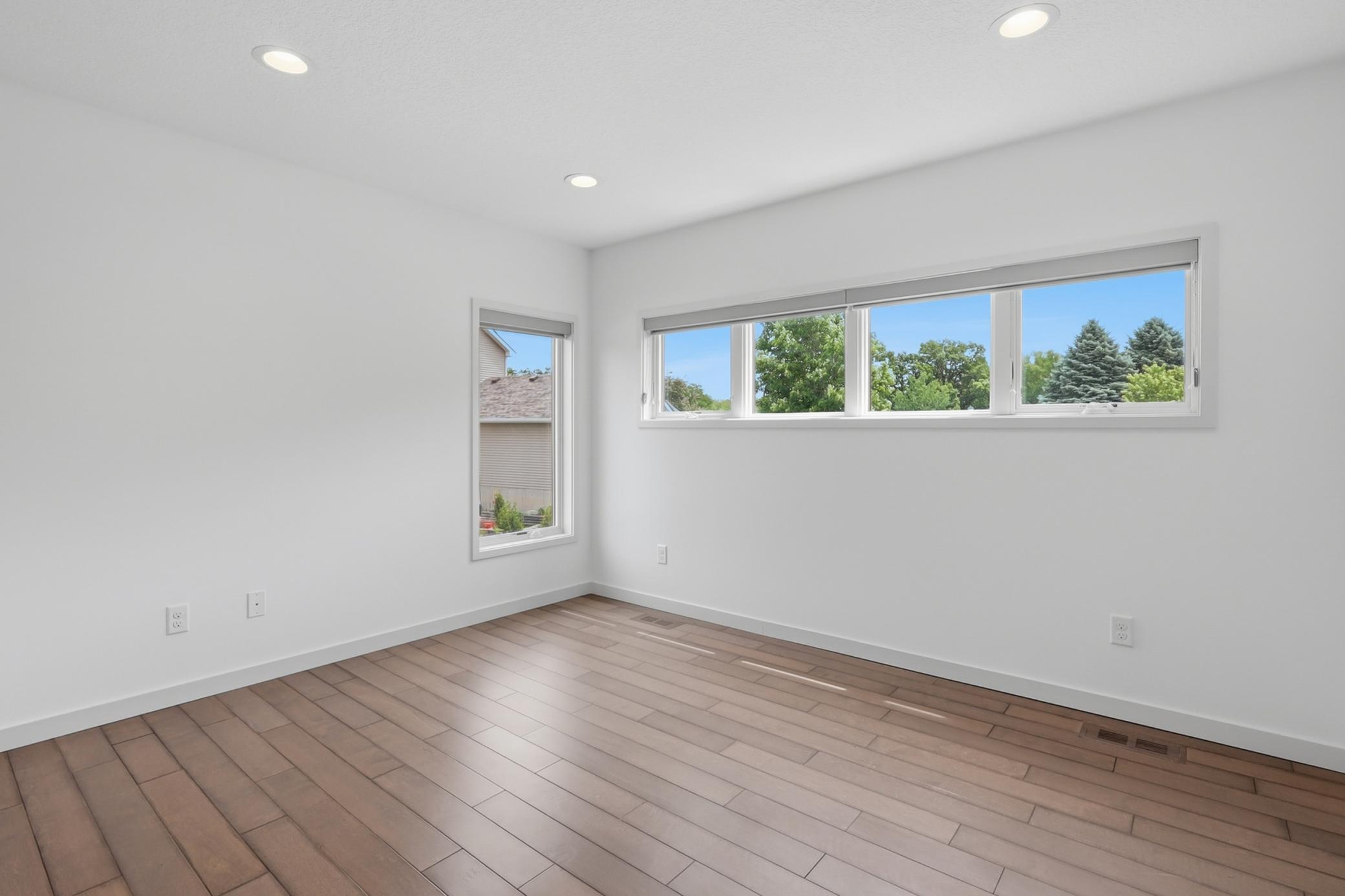 One of three upper level bedrooms.