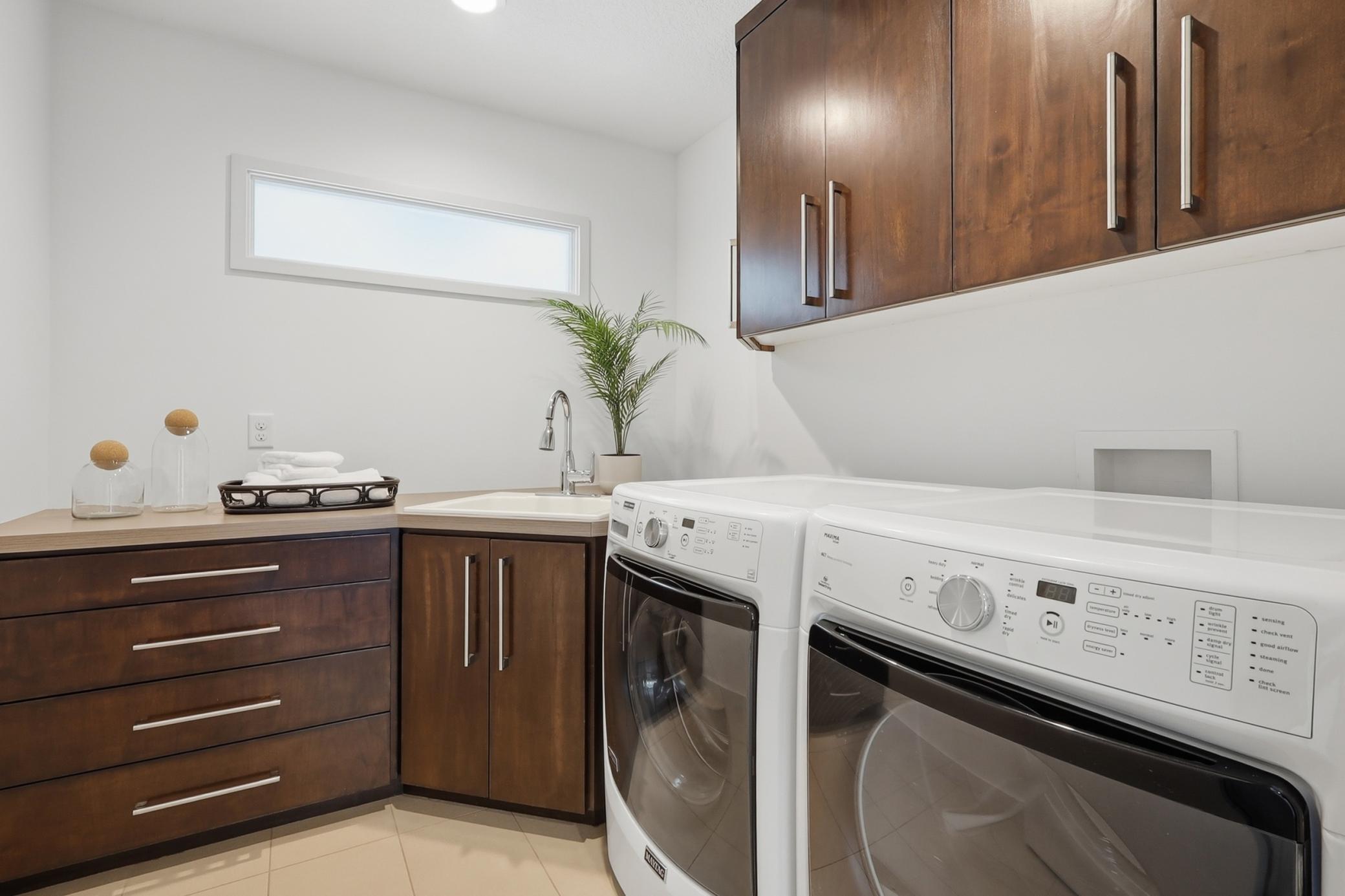 Another well-planned feature is the second laundry room/washer and dryer on the upper level.
