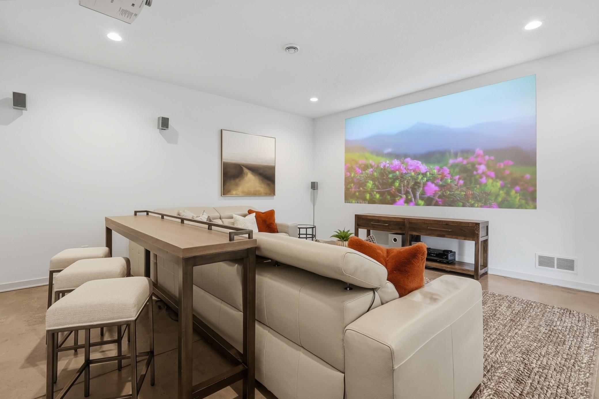 Enjoy movies and epic gaming sessions in the dedicated theater room for an audio-visual escape. Extra insulation was installed for sound protection. A/V components can stay with the home.