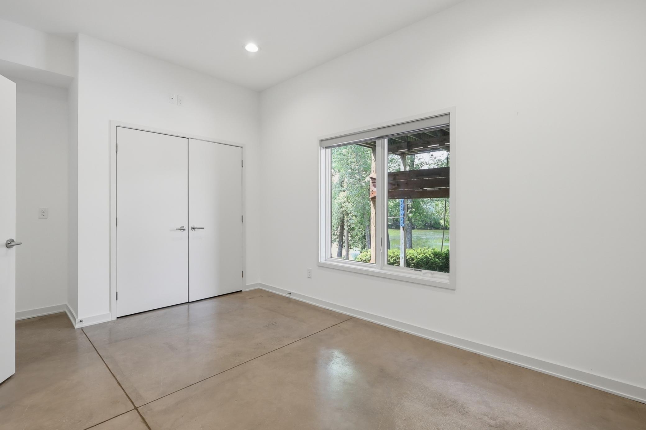 Used as an office, the lower level has a large bedroom right across from the lower level bathroom. It's a perfect work space or a private guest zone!