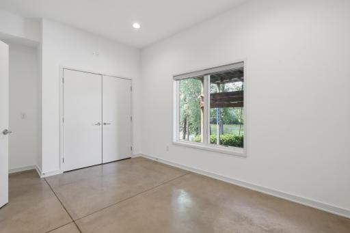 Used as an office, the lower level has a large bedroom right across from the lower level bathroom. It's a perfect work space or a private guest zone.