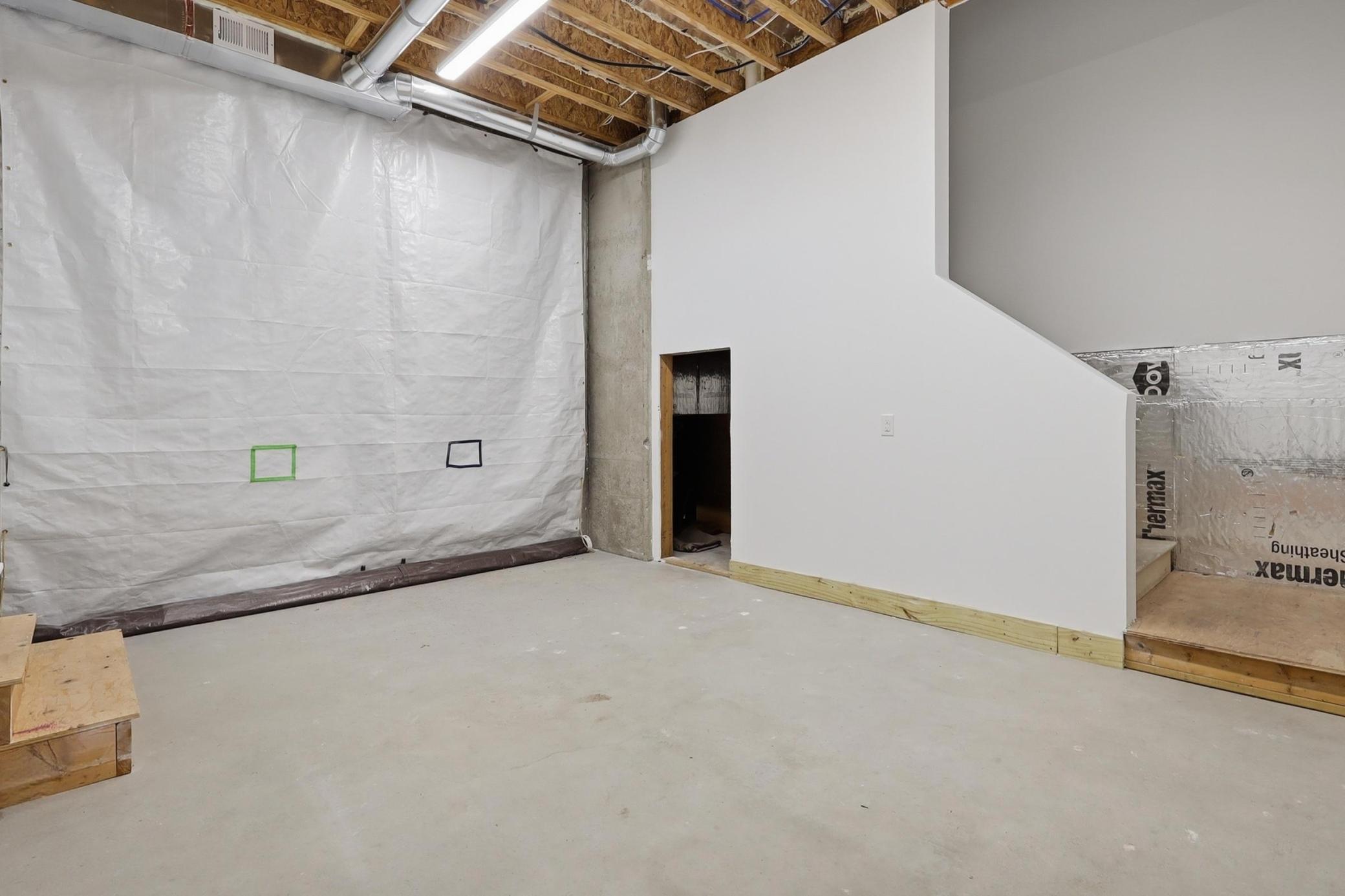 This heated storage garage has a staircase leading up to the three-car garage and doors leading out to the backyard. A definite favorite feature of the home!