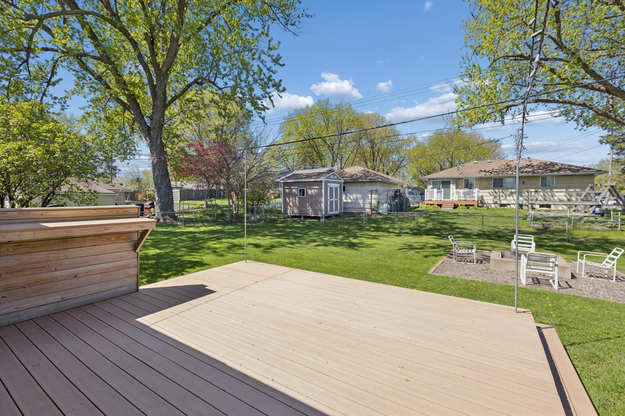 Deck overlooks backyard