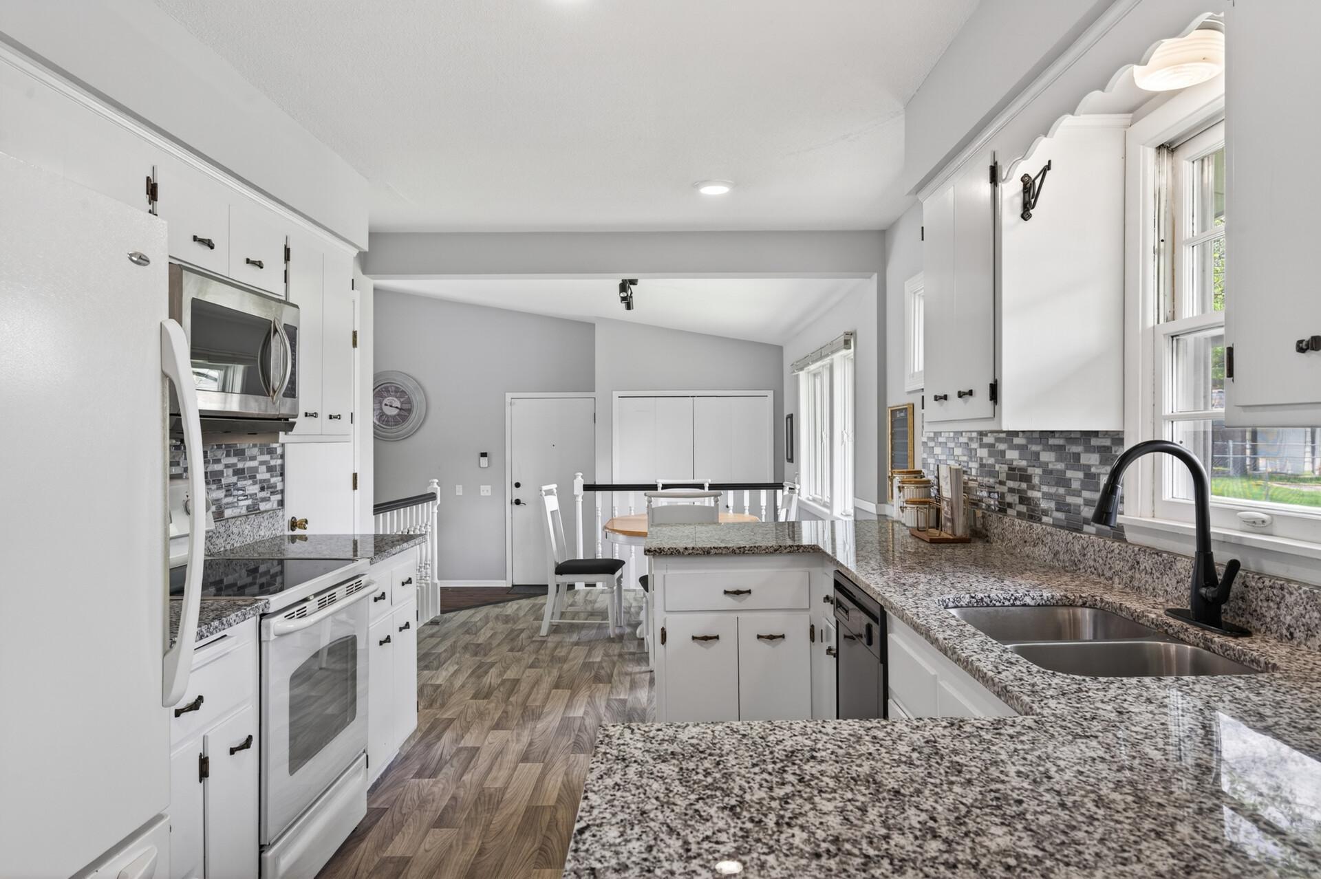 Updated kitchen with great flow into the adjacent family room..jpg
