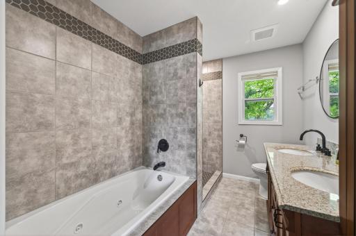 Separate jacuzzi tub + tiled walk-in shower = everyday luxury..jpg