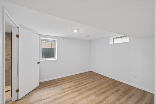 Newly added lower-level bedroom adds flexibility for guests or office use.jpg