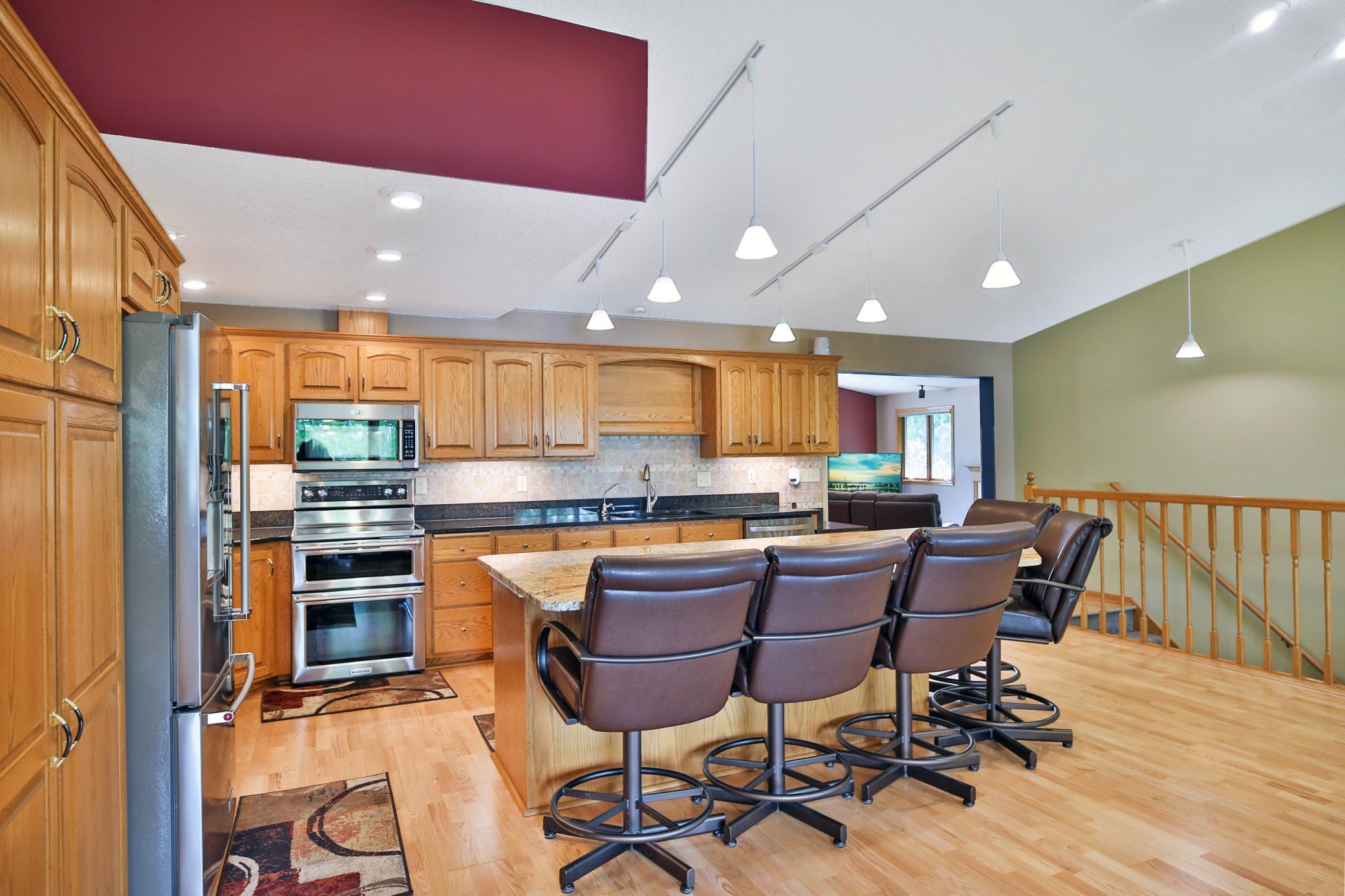 Kitchen with double over custom cabinetry