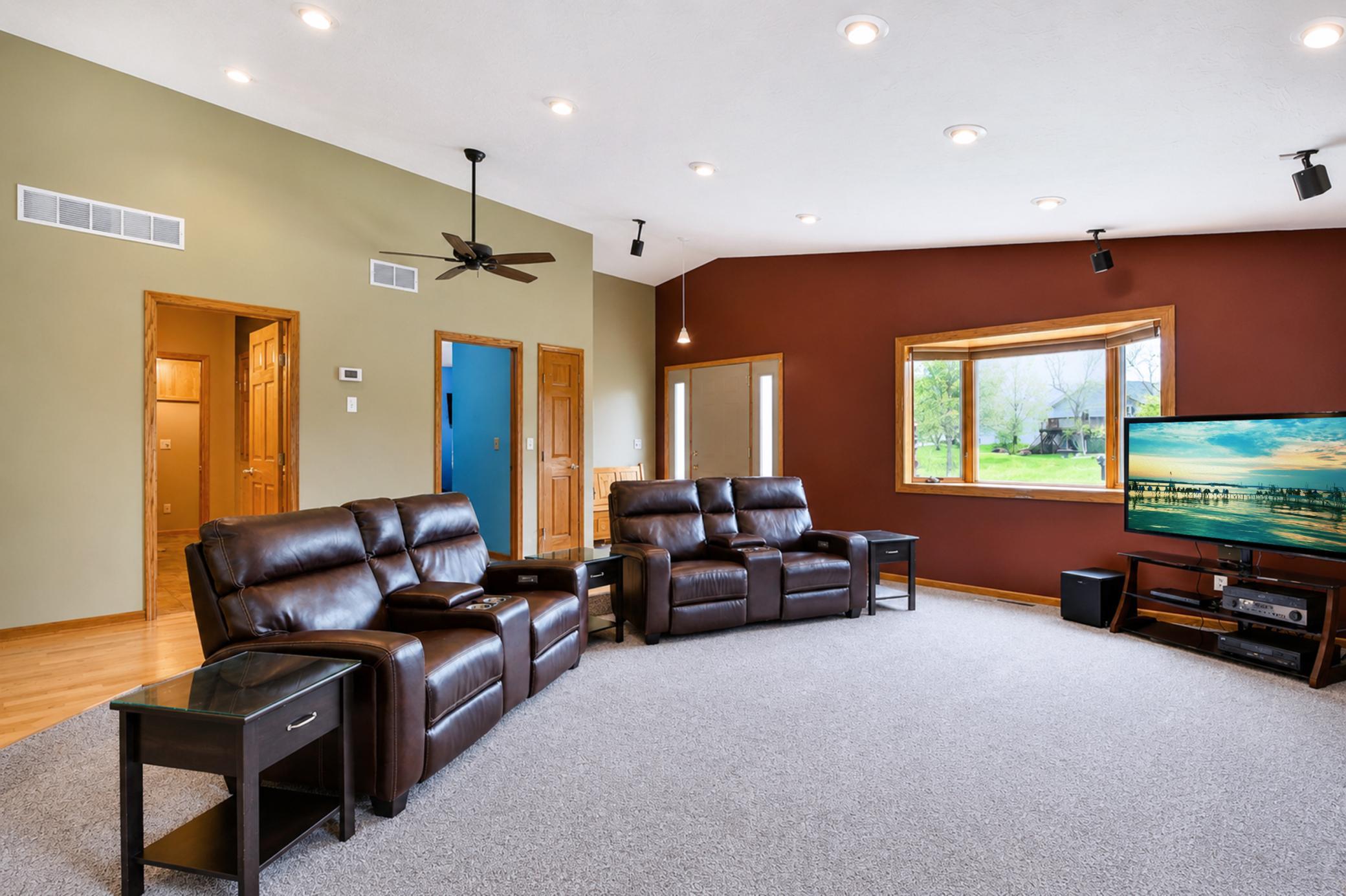 Living room with large window looking out over the garden area