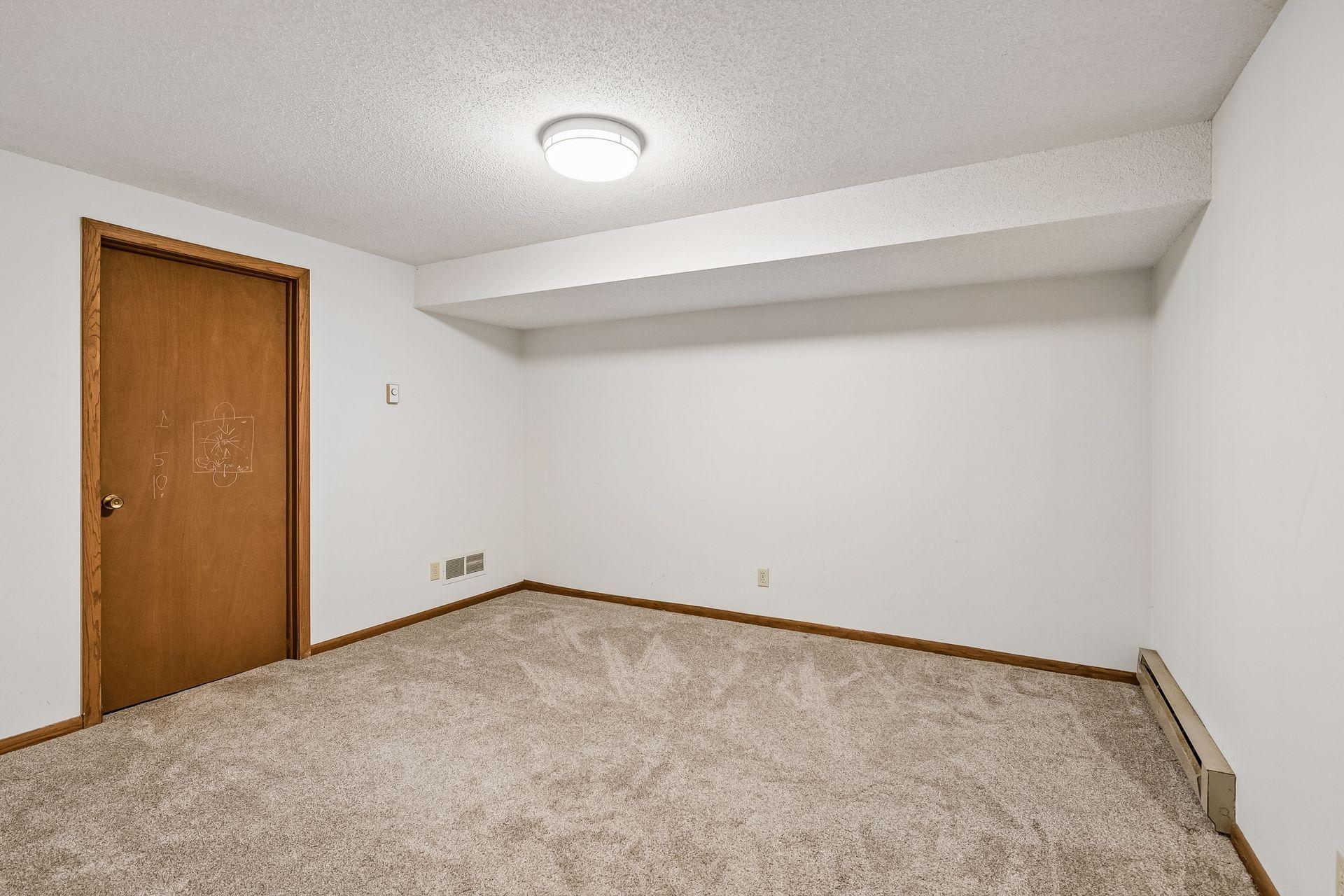 Flex Room in the lower level is a perfect Home Office, 5th non-conforming Bedroom, work out room or playroom