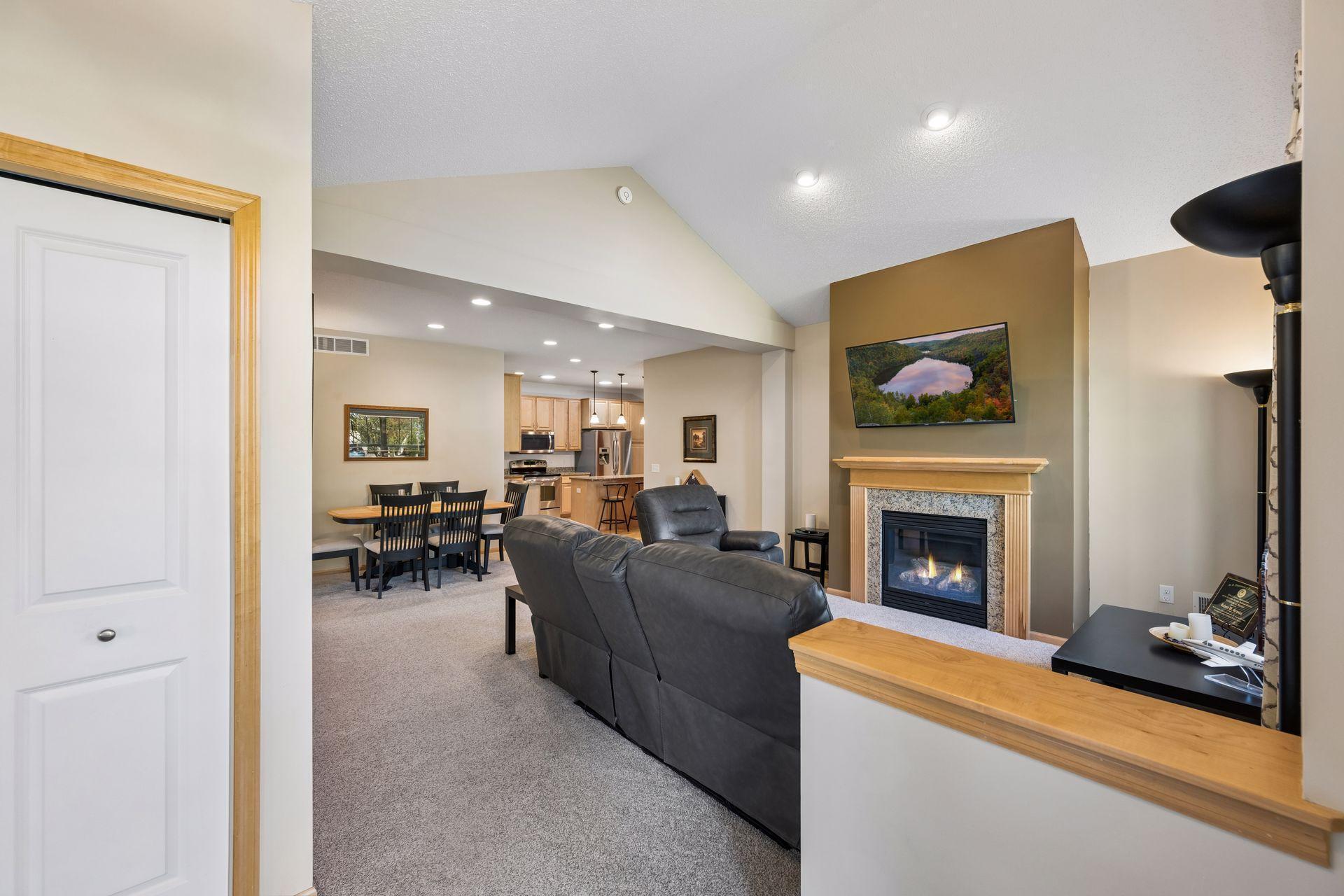 Ceramic tile entry opens into the dramatic living room with views into the heart of the home.