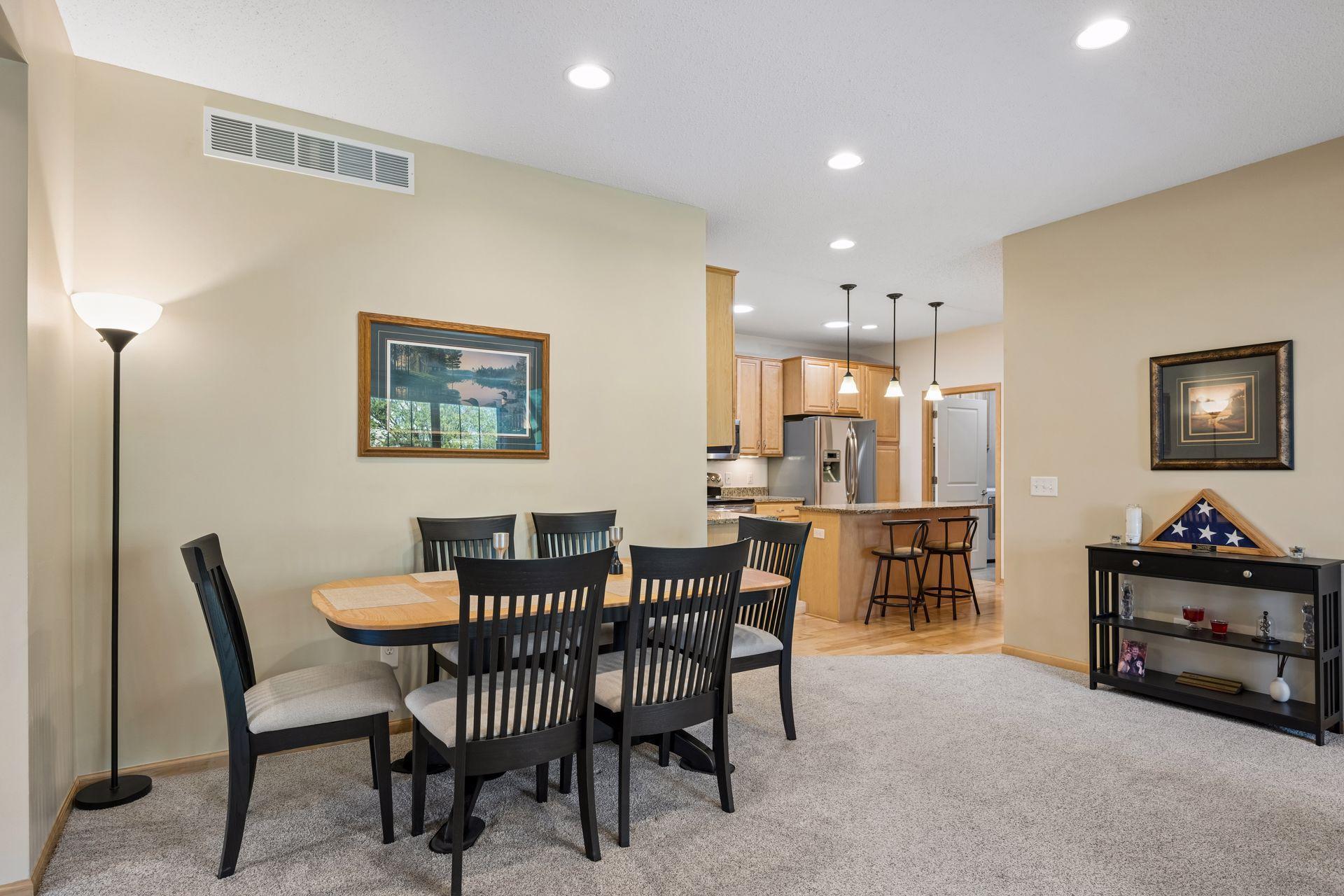 Flexible dining area offers a variety of configurations and space for sideboard, etc.