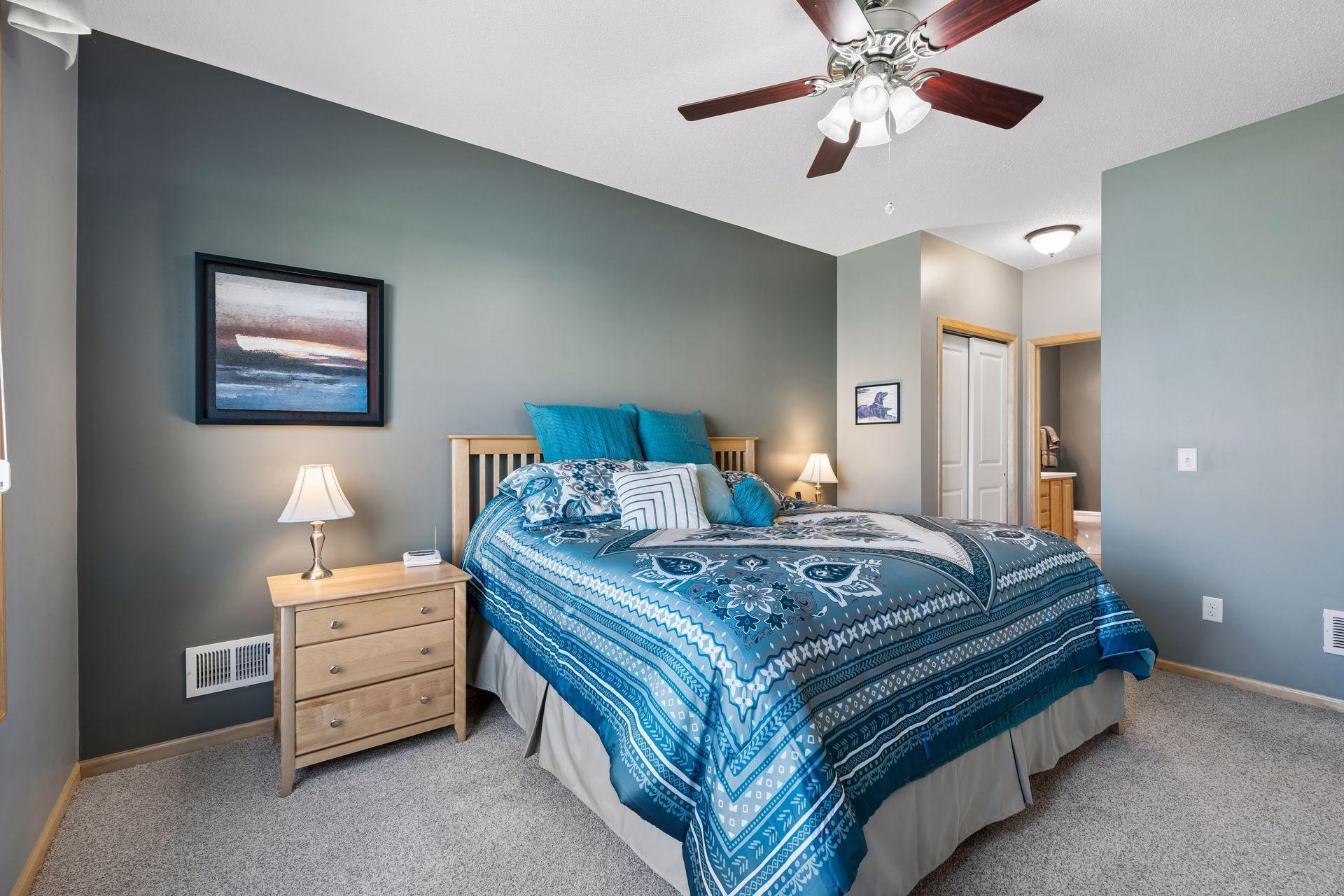 Another angle of the primary suite looking into the dual closets and private bath.