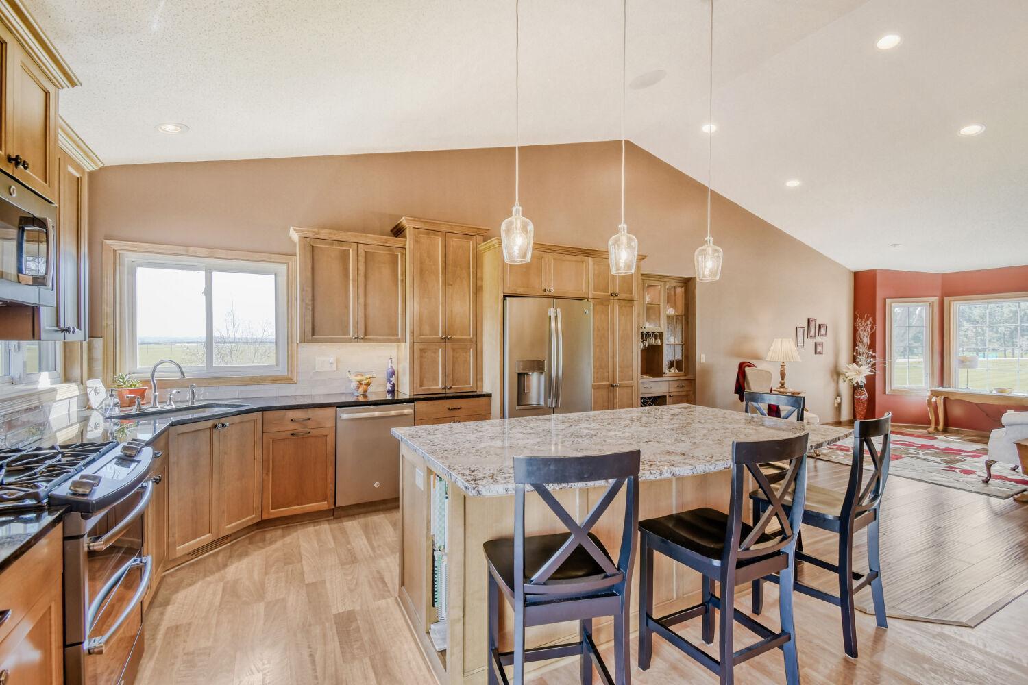 Beautifully updated kitchen with custom alder wood cabinets, granite counter tops, & stainless steel appliances