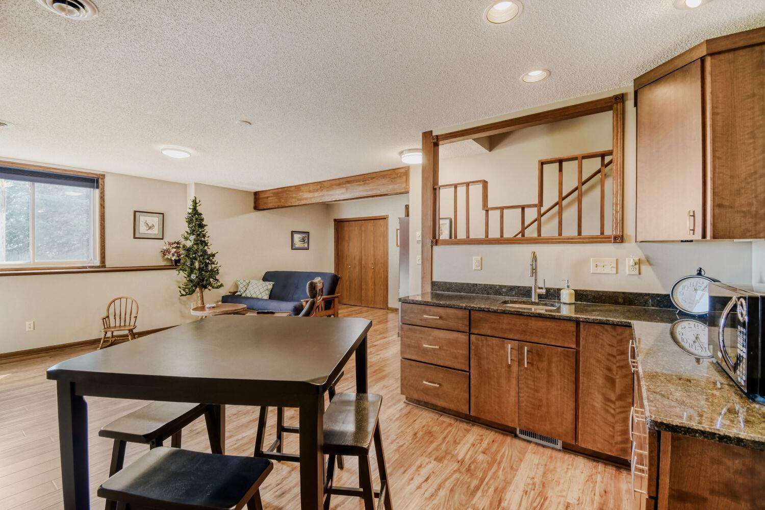 Lowest level wet bar/rec room with lookout window that allow lots of natural light