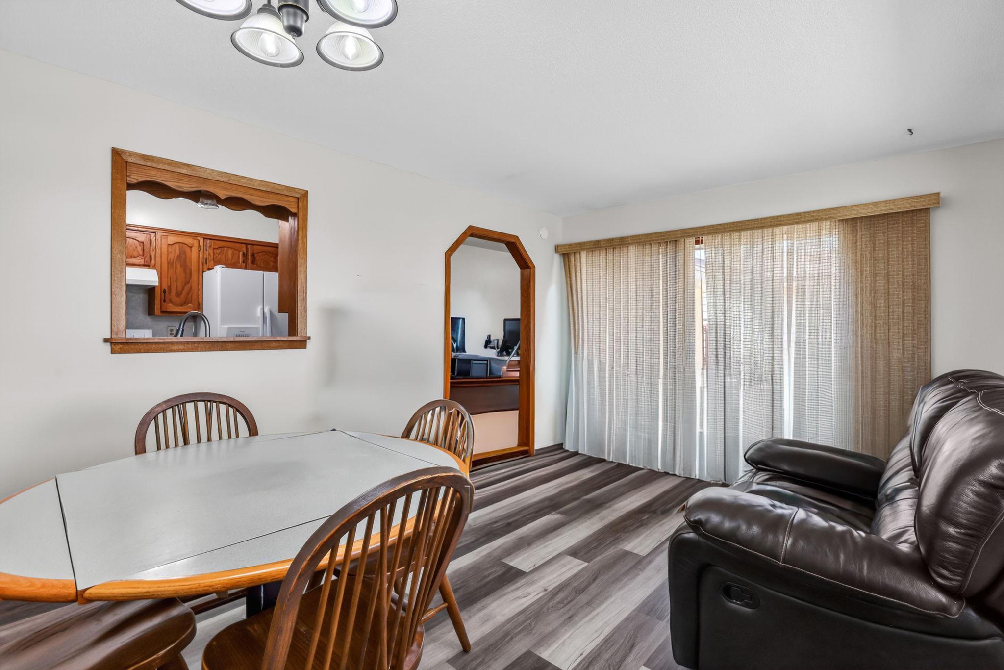 Sliding door opens to the spacious deck, convenient for grilling & entertaining.