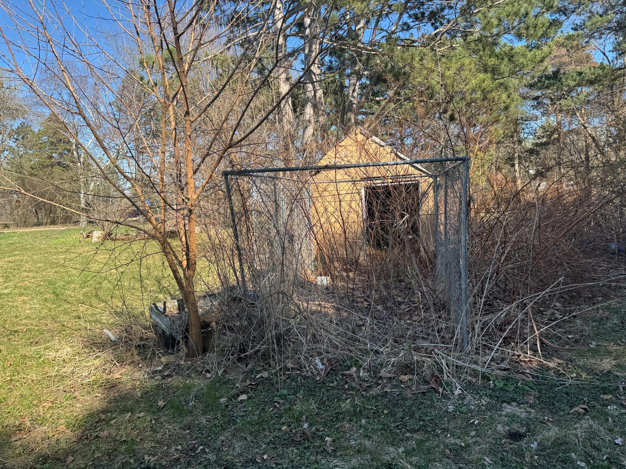 Storage shed with kennel.