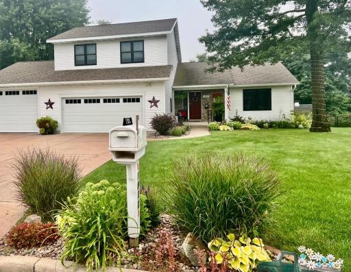 summertime views showing landscaped to the curb.jpg