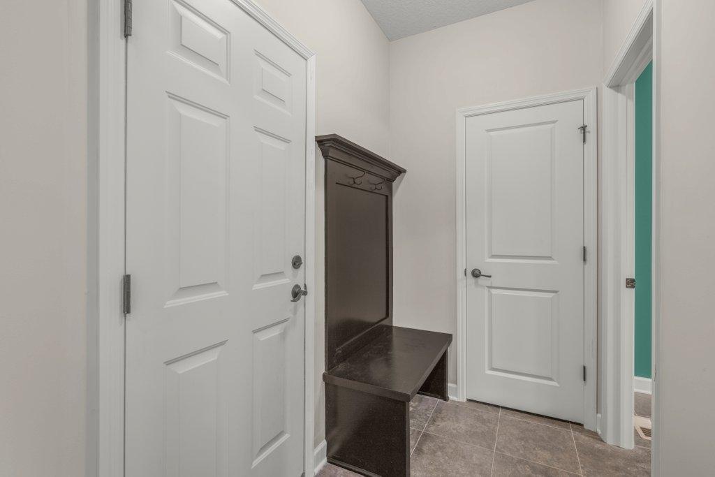 Mudroom w/hall tree off the garage + coat closet