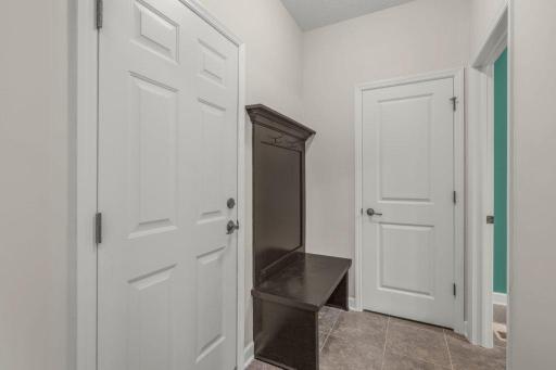 Mudroom w/hall tree off the garage + coat closet