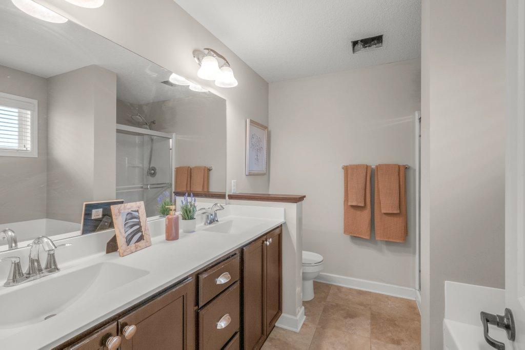 Double sinks + shower + huge garden tub
