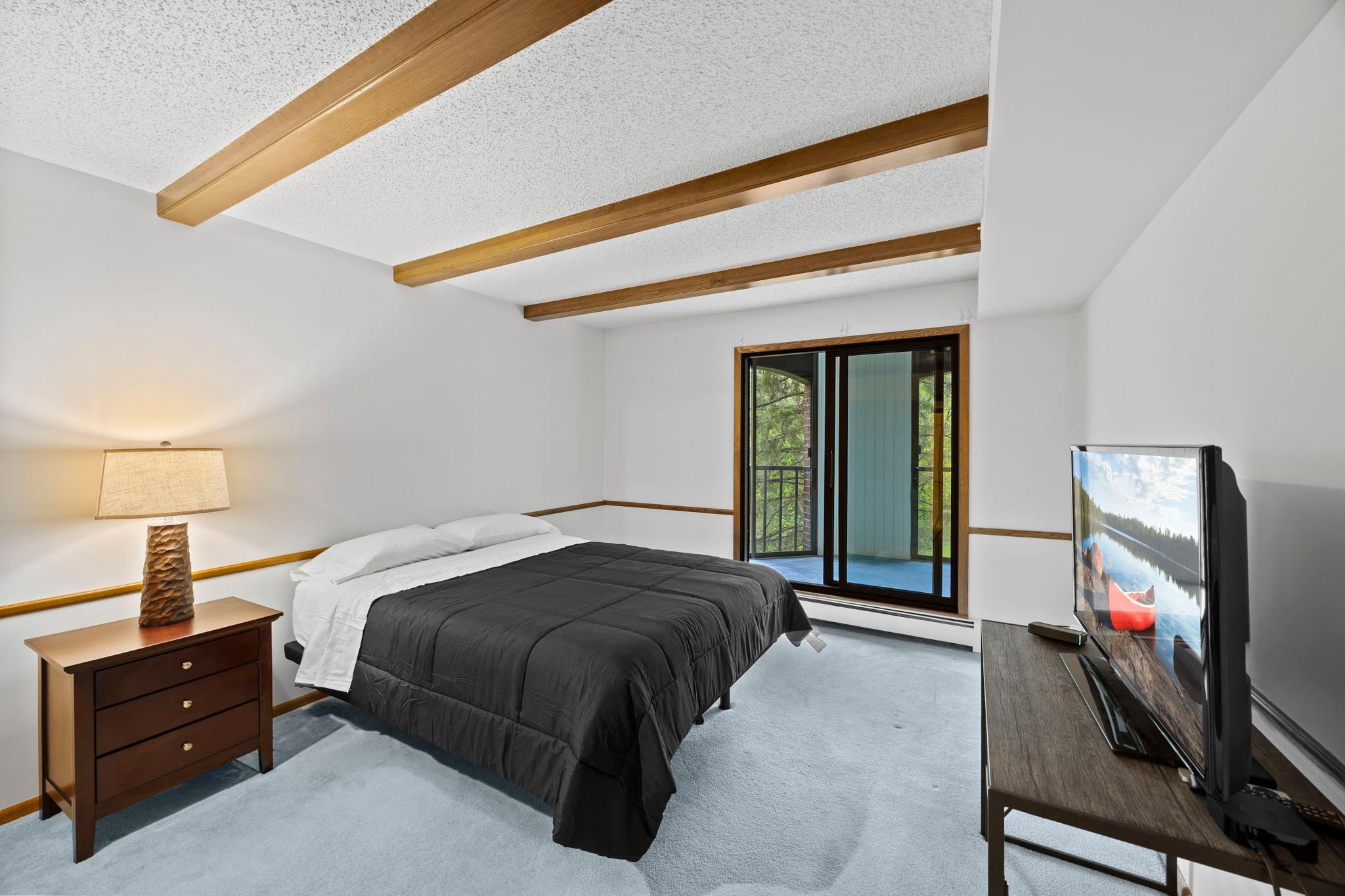 It also offers direct walkout access to the three-season porch, enhancing both light and indoor-outdoor flow.